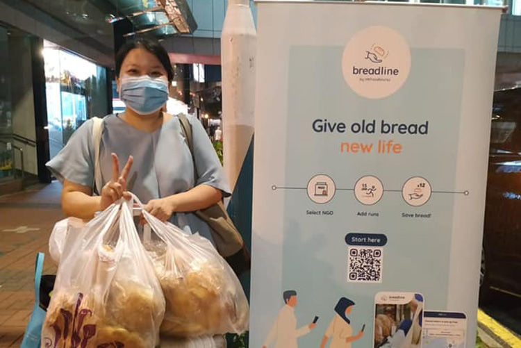 Carol Wong carrying left over bread for Breadline